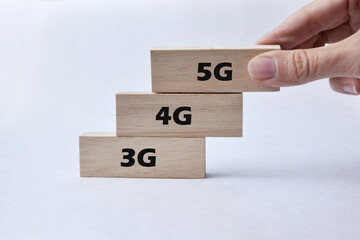 Wooden cubes with the inscription: 3G, 4G, 5G. A symbol of replacing the old Internet with a new...