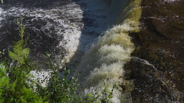Tahquamenon WaterFall Drop-Off Point - force of water rushing off into pool below; water droplets, spray and foam of churning water in the pool below. 205 
