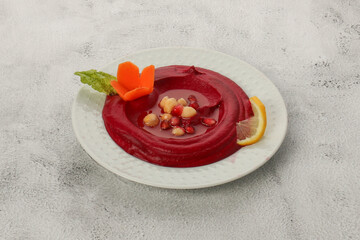 Tahini red beet salad with pomegranate seeds and chickpeas