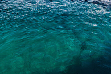 Sailing from boat with coast in horizon during clear day in Spain, Mallorca