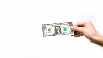 expensive to one dollar. Hand holding one dollar banknote