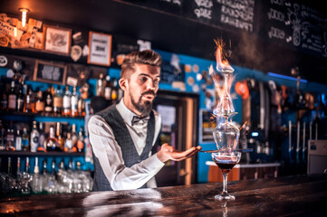Bartender concocts a cocktail in the bar