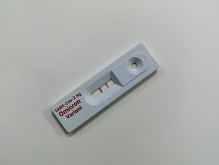 Rapid test cassette isolated for new variant of the Covid-19 Omicron B.1.1.529 test. one show positive another negative result. new strain of covid-19, Omicron