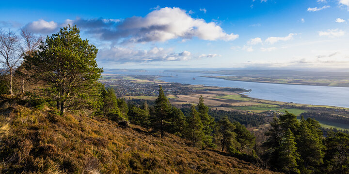 the view from the fyrish monument above Alness and the Cromarty Firth near Inverness showing oil rigs being constructed