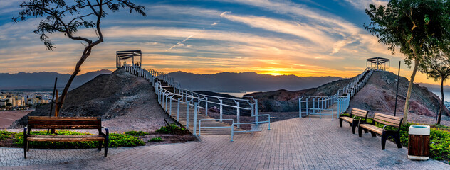 Panorama. Sunrise at  a top of the mounts  in vicinity of Eilat - famous tourist  resort and recreational city in Israel