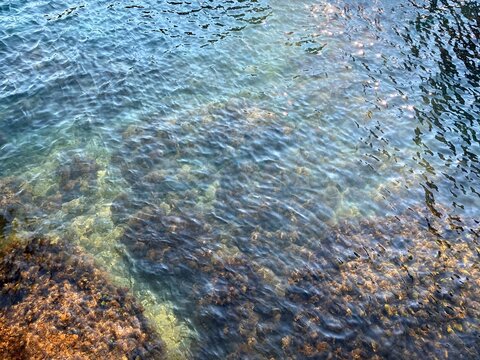 Blue turquoise sea water waves background. Calm rippled blue green Mediterranean sea surface. Beautiful seascape.
