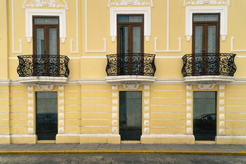 Bright Yellow Wall with Windows - 473000556