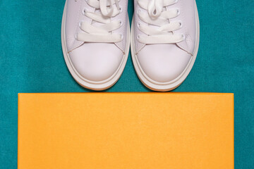 white sneakers,  colored  background. sport shoes,   Lifestyle sneakers sport shoes. Stylish white sneakers