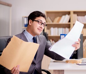 Businessman receiving letter envelope in office