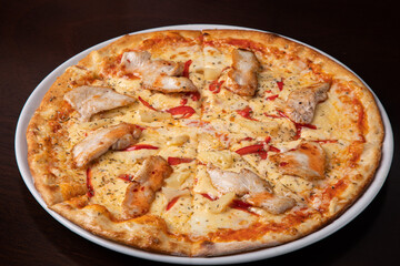 Pizza quattro stagioni four seasons pizza with cheese and chicken 