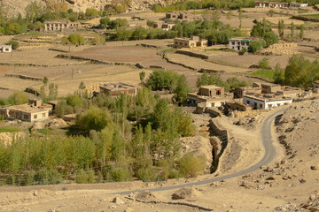 Curvy road of Leh with green land view from top, Ladakh, Union territory, India. View from distance of Himalayan mountains.