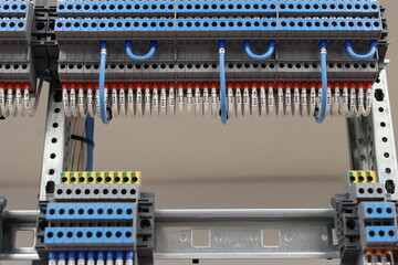  electrical terminals, mounted on a din rail. Connection by mounting wire.