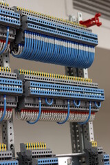  electrical terminals, mounted on a din rail. Connection by mounting wire.