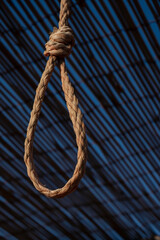 Rope noose on blue background - obrazy, fototapety, plakaty