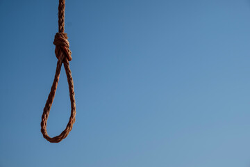Rope noose on blue sky. Space for text - Suicide - obrazy, fototapety, plakaty