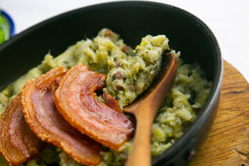 Trinxat de la Cerdaña. Typical recipe from the north of Catalonia cooked with white cabbage, potato and bacon.