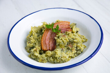 Trinxat de la Cerdaña. Typical recipe from the north of Catalonia cooked with white cabbage, potato and bacon.