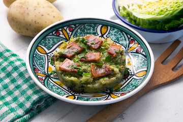 Trinxat de la Cerdaña. Typical recipe from the north of Catalonia cooked with white cabbage, potato and bacon.