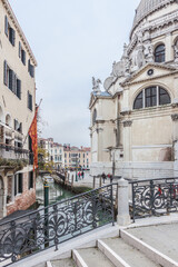 Canals of Venice with its typical gondolas , palaces and italian architecture
