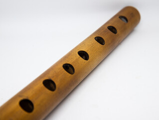 Bamboo flute isolated on white background. © Celluloidphotography