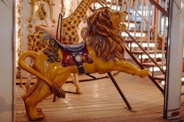 Vintage carousel with artificial lion on it