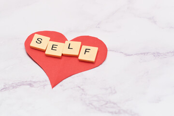 Alphabet blocks with the word self love. concept love yourself.