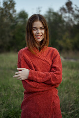 woman red sweater cool air nature romance