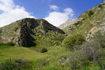 Landscape with sky and clouds. Rocks and hills