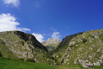 Landscape with sky and clouds. Rocks and hills