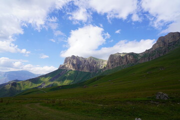 Landscape with sky and clouds. Rocks and hills