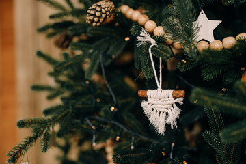 beautiful Christmas toy on a Christmas tree with macrame close up