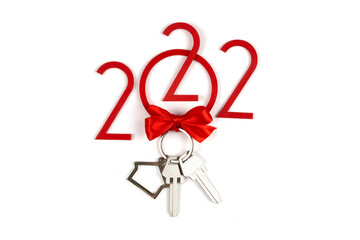 background 2022 New year and Christmas. Banner with keys and keychain. Real estate purchase concept. Sale, rent. Get the keys to the apartment as a gift