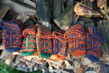 Colorful traditional Bosnian wool socks priglavke on wood