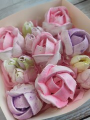 sweet marshmallow in the form of roses. Festive dessert.	