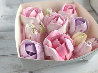 sweet marshmallow in the form of roses. Festive dessert.	
