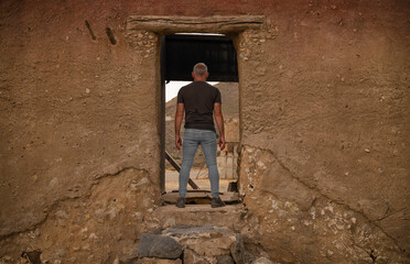 Obraz na płótnie Canvas Adult man in film set in Tabernas desert, Almeria, Spain