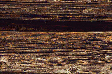Naklejka premium Closeup picture of old rustic wooden planks eaten by caries