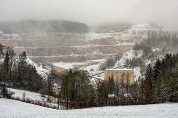 A quarry on a foggy winter day