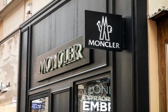 The logo of Moncler fashion company above the storefront where the clothing is sold
