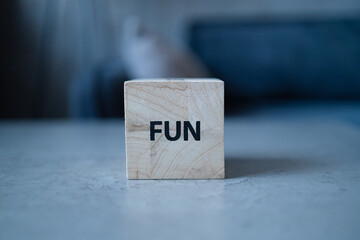 Fun stamp letters text on wood blocks on the concrete table