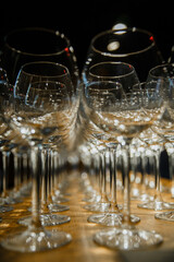 Clean, beautiful glass empty wine glasses. Lots of empty glasses, party preparation