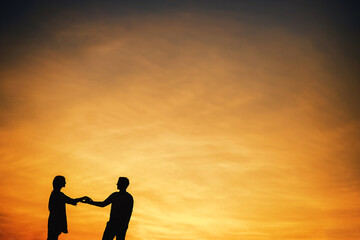 Fototapeta na wymiar Silhouette of a couple in love against the sunset sky. 