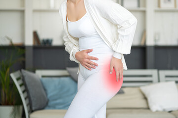Hip pain, woman suffering from osteoarthritis at home, health problems concept - obrazy, fototapety, plakaty