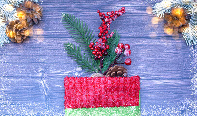 Christmas wooden background with a tet and a Christmas tree toy.