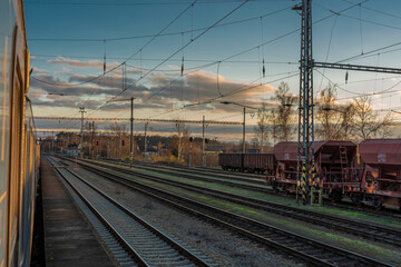 Fototapeta na wymiar Blue electric engine with fast expres train in Cicenice station in cold day