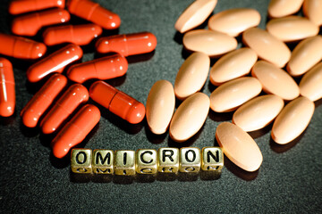 Omicron antiviral tablets. Antiviral drugs. Inscription omicron from letters