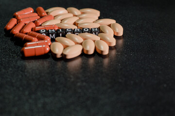 Omicron antiviral tablets. Antiviral drugs. Inscription omicron from letters