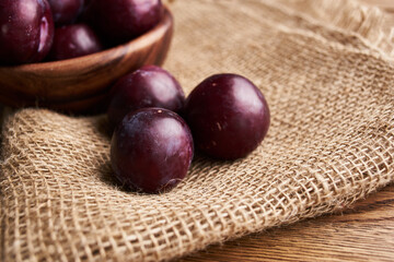plums fruits natural products on a wooden table top view