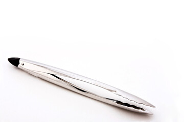 Metal kitchen tongs, stainless steel for serving, isolated on white background