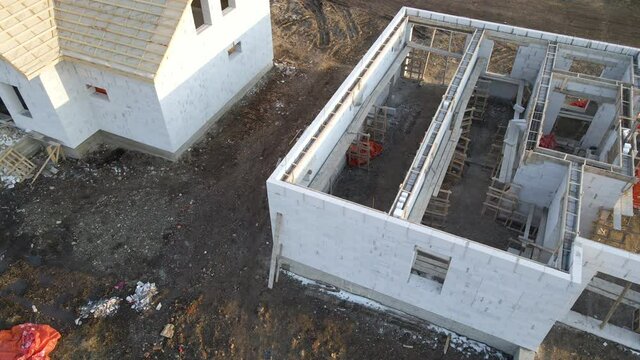 Aerial view of unfinished frame of private house foundation under construction